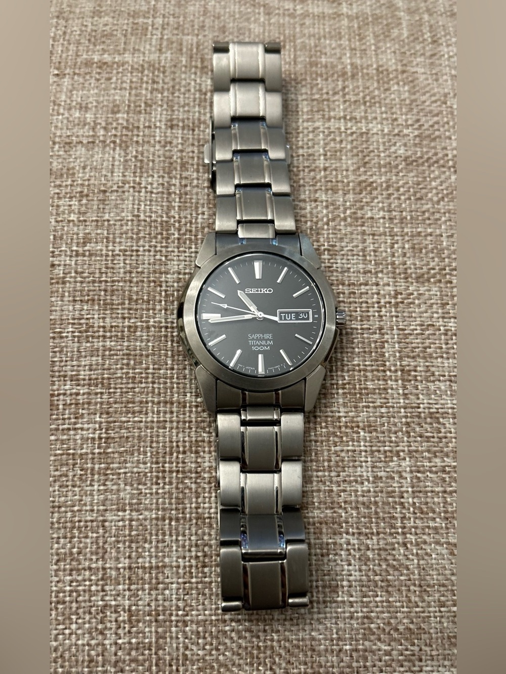 Seiko Titanium 7N43-0ASO
 Sapphire 100M Quartz Day-Date Watch
